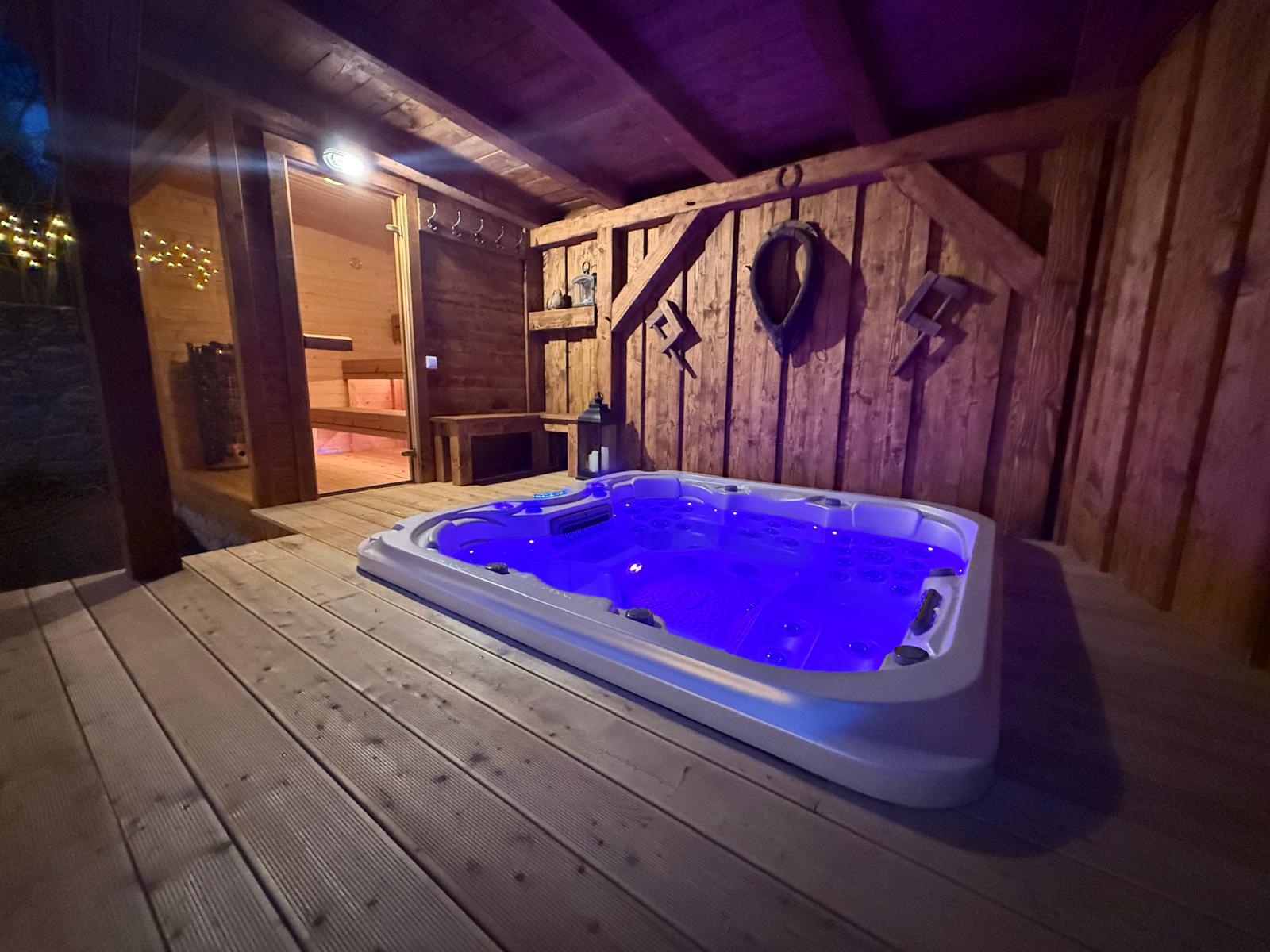 Private hot tub and sauna at night